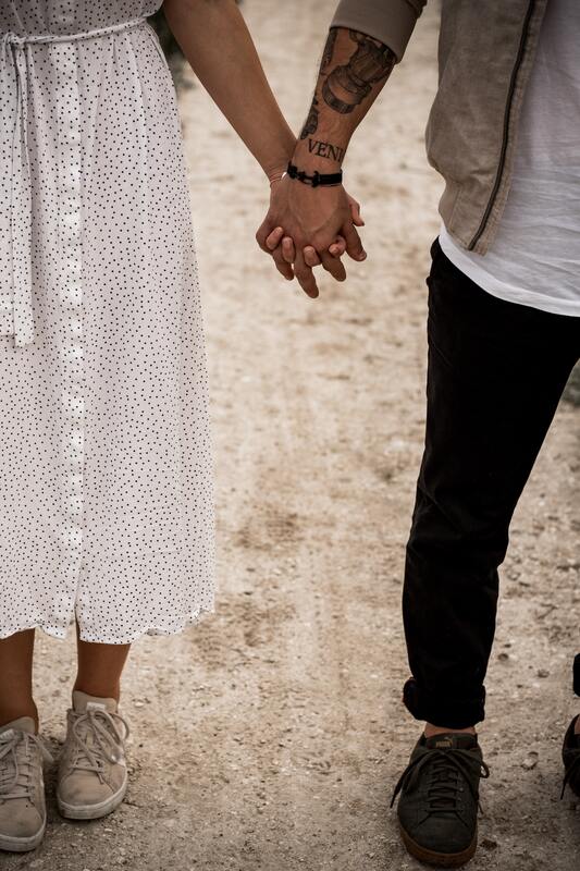 A man and woman holding hands. This represents that Sacred Circle Holistic Healing helps young adults who struggle to set healthy boundaries in relationships.